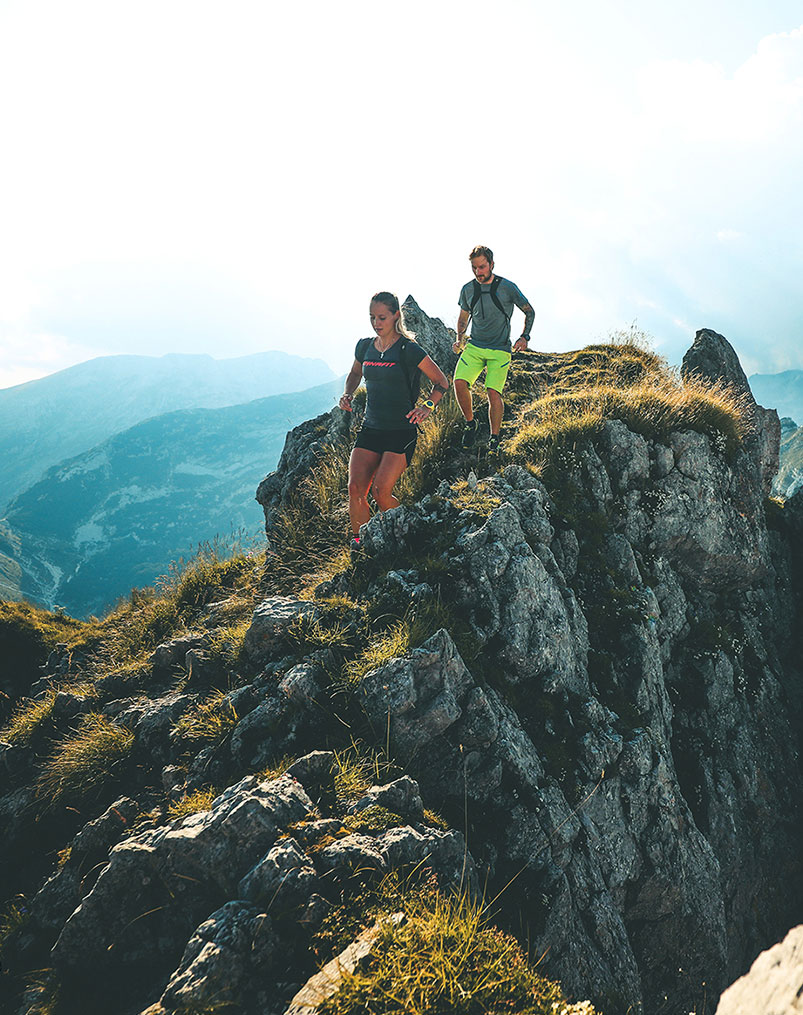 Runners on a mountain ridge in Slovenia